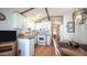 Cozy kitchen featuring white cabinets and wood laminate floors at 312 S Emerald Dr, Apache Junction, AZ 85119