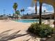 Community pool area with lounge chairs and landscaping at 312 S Emerald Dr, Apache Junction, AZ 85119