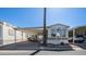 Mobile home with carport and golf cart at 312 S Emerald Dr, Apache Junction, AZ 85119