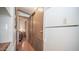 Simple hallway with wood flooring and access to bedrooms at 312 S Emerald Dr, Apache Junction, AZ 85119