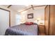 Comfortable bedroom with double bed and built-in shelving at 312 S Emerald Dr, Apache Junction, AZ 85119