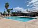 Inviting community pool with lounge chairs at 312 S Emerald Dr, Apache Junction, AZ 85119