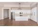 Modern kitchen with white cabinets, island, and stainless steel appliances at 20618 W Elliot Rd, Buckeye, AZ 85326