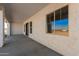 Covered patio with concrete flooring and windows at 20618 W Elliot Rd, Buckeye, AZ 85326