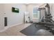 Home gym with various equipment and a large mirror at 10538 W Quail Ave, Peoria, AZ 85382