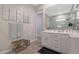 Elegant bathroom with double vanity, large mirror, and modern finishes at 10538 W Quail Ave, Peoria, AZ 85382