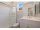 Clean bathroom with white vanity, shower, and tile floor at 10538 W Quail Ave, Peoria, AZ 85382