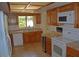 Kitchen with wood cabinets, granite counters and appliances at 7435 E Sundance Trl # 403, Carefree, AZ 85377