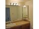 Bathroom boasts granite countertop, large mirror, and modern vanity at 7435 E Sundance Trl # 403, Carefree, AZ 85377