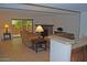 Living room with tiled floors, fireplace and patio access at 7435 E Sundance Trl # 403, Carefree, AZ 85377