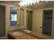Double vanity bathroom with granite countertop and large mirror at 7435 E Sundance Trl # 403, Carefree, AZ 85377