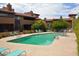 Community pool with plenty of lounge chairs for relaxation at 7435 E Sundance Trl # 403, Carefree, AZ 85377