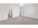 Spacious bedroom with ceiling fan and neutral carpeting at 16682 W Pacheco Ct, Surprise, AZ 85387