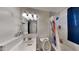 Updated bathroom with a white vanity, toilet, and bathtub at 1701 W Highland Ave, Phoenix, AZ 85015