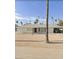Ranch-style home with gravel driveway and palm trees at 1701 W Highland Ave, Phoenix, AZ 85015