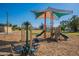 Playground with spinner and slides, providing fun for children at 1701 W Highland Ave, Phoenix, AZ 85015