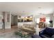 Bright and airy living area with an open floor plan and views into the dining and kitchen areas at 17807 N Navarro Ct, Surprise, AZ 85374