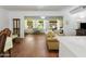 Bright living room with hardwood floors and view to backyard patio at 9701 W Oak Ridge Dr, Sun City, AZ 85351