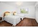 Guest bedroom with two twin beds and hardwood floors at 9701 W Oak Ridge Dr, Sun City, AZ 85351