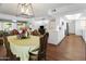 Dining room with a table, chairs, and open kitchen view at 9701 W Oak Ridge Dr, Sun City, AZ 85351