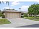 Single-car garage with driveway and landscaping at 9701 W Oak Ridge Dr, Sun City, AZ 85351