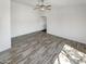 Spacious living room with wood-look tile flooring at 563 S 230Th Ave, Buckeye, AZ 85326
