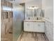 Updated bathroom with double vanity and glass shower at 563 S 230Th Ave, Buckeye, AZ 85326
