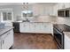 White kitchen with granite countertops and stainless steel appliances at 563 S 230Th Ave, Buckeye, AZ 85326