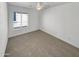 Bright bedroom with neutral carpet and ceiling fan at 563 S 230Th Ave, Buckeye, AZ 85326