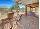 Outdoor kitchen and pergola covered patio with brick pavers at 563 S 230Th Ave, Buckeye, AZ 85326