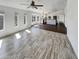 Open living area with kitchen views and wood-look tile at 563 S 230Th Ave, Buckeye, AZ 85326