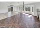 Open concept dining room and living area with tile flooring at 563 S 230Th Ave, Buckeye, AZ 85326