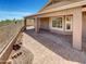 Covered patio with brick pavers and scenic views at 563 S 230Th Ave, Buckeye, AZ 85326