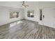 Spacious living area with wood-look floors and lots of natural light at 563 S 230Th Ave, Buckeye, AZ 85326