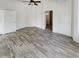 Bedroom with access to bathroom and wood-look tile floors at 563 S 230Th Ave, Buckeye, AZ 85326