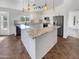Modern kitchen with granite countertops and stainless steel appliances at 563 S 230Th Ave, Buckeye, AZ 85326
