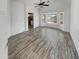 Large main bedroom with wood-look floors and access to bathroom at 563 S 230Th Ave, Buckeye, AZ 85326