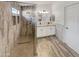 Elegant bathroom with walk-in shower, double vanity, and updated fixtures at 563 S 230Th Ave, Buckeye, AZ 85326