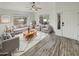 Bright living room featuring wood-look floors and comfy seating at 563 S 230Th Ave, Buckeye, AZ 85326