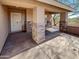 House entrance with stone columns and a security door at 563 S 230Th Ave, Buckeye, AZ 85326