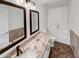 Updated bathroom with granite vanity and tiled floors at 563 S 230Th Ave, Buckeye, AZ 85326
