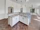 Open concept kitchen with a large island and granite countertops at 563 S 230Th Ave, Buckeye, AZ 85326