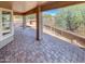 Covered patio with brick pavers, offering an outdoor entertaining space at 563 S 230Th Ave, Buckeye, AZ 85326