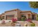 Beautiful stucco home with a two-car garage and landscaping at 26 S Quinn Cir # 7, Mesa, AZ 85206