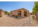 Private backyard with covered patio and gravel at 26 S Quinn Cir # 7, Mesa, AZ 85206