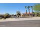 Gated community entrance with palm trees at 26 S Quinn Cir # 7, Mesa, AZ 85206