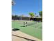 Community tennis court with seating at 26 S Quinn Cir # 7, Mesa, AZ 85206