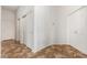 Hallway with tile flooring and multiple doors at 26 S Quinn Cir # 7, Mesa, AZ 85206