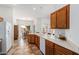 Kitchen boasts a large island, oak cabinets, and tile flooring at 26 S Quinn Cir # 7, Mesa, AZ 85206