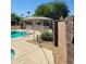 Community pool with a covered patio and BBQ area at 26 S Quinn Cir # 7, Mesa, AZ 85206